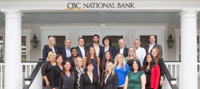 CBC workers in front of CBC National Bank building