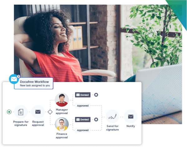 Woman smiling in an office chair with Docufree workflow on her computer