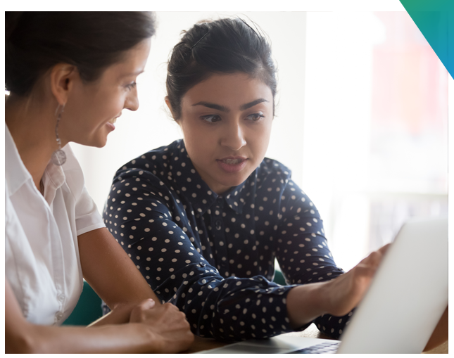 Two women looking at a computer